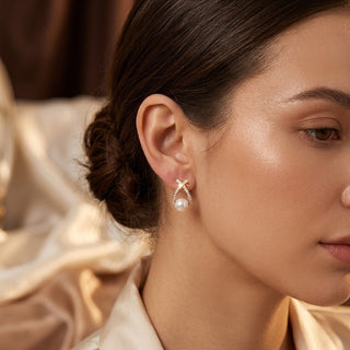 Gold cross pearl stud earrings